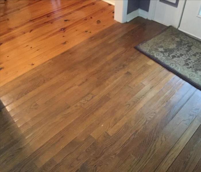 hardwood floor laying flat after being dried following water damage