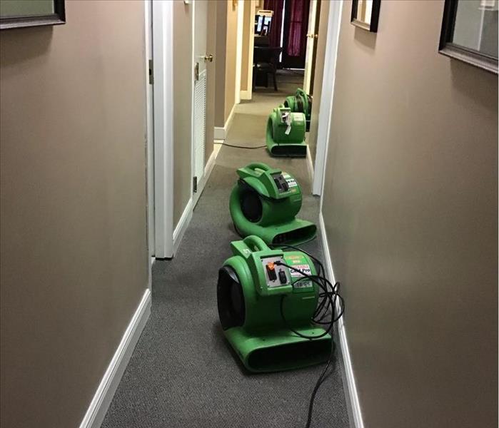 green air movers in long hallway 