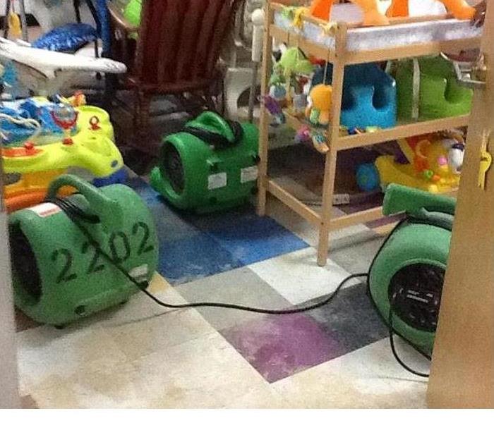 green air movers on tile floor
