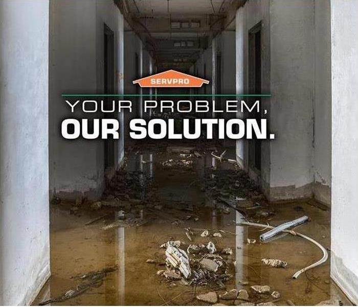 Picture of water damage with SERVPRO orange house logo 